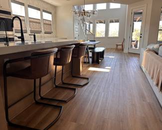 $120 each       "Faux Leather Counter Stool
Room: Kitchen
Faux leather upholstery with rubbed gold frame.
21""W x 21""D x 35""H"		