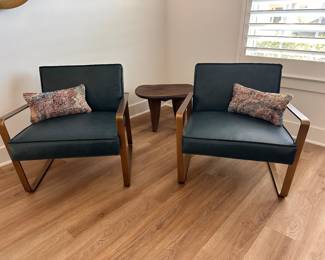 $850 each   Vintage peacock top grain leather with an exposed antique
brass steel frame.
26.5"W x 31"D x 27"H