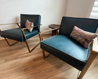 $850 each   Vintage peacock top grain leather with an exposed antique
brass steel frame.
26.5"W x 31"D x 27"H