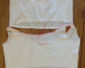 Edwardian corset covers.  French with lovely hand embroidery.  Laundered with me ribbons.  We have a dozen or so of these 