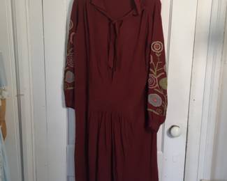 Vintage 1920s drop waisted dress with yarn embroidered sleeves.