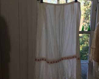 1920s fine lawn cotton petticoat with hand embroidery.  Laundered with original ribbon