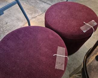 Two purple ottomans with storage