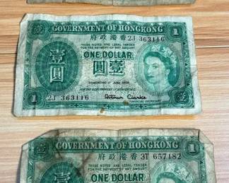 Three vintage onedollar banknotes issued by the Government of Hong Kong
