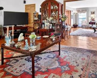 The coffee table, area rug and Arched cabinet in the back are all for sale.