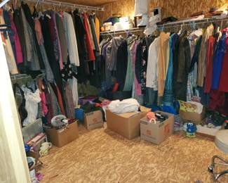 Many, many high-end items of clothing in the basement walk-in closet.  Plus, there are many coats in the upstairs hall and bedrooms.