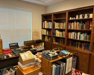 A vast library featuring cookbooks from around the world, engineering texts, a huge collection of Arabian Nights, origami books, vintage and antique volumes, and more.