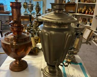 Collection of classic samovars featuring ornate handles, spouts, and traditional silhouettes — perfect for collectors or décor enthusiasts.