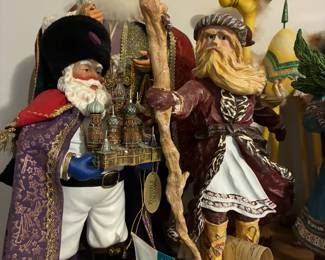 A festive array of Christmas décor, including Russian Santas, Babouskas, Charlie Brown pieces, and stunning ornaments.