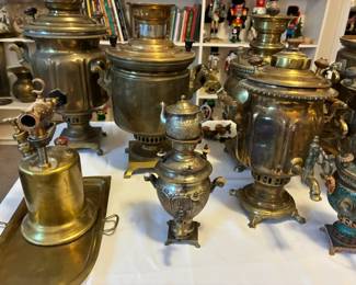 Grouping of samovars with traditional Eastern European design elements — a wonderful glimpse into old-world craftsmanship.