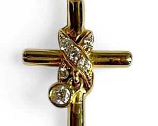 An 18k Gold and Diamond Cross Pendant
