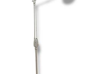 A Vintage Industrial Articulating Floor Lamp
