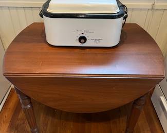 Drop-leaf table with two leaves (leaves not shown).