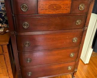Antique traditional five-drawer chest of drawers.