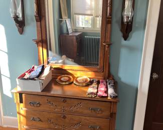 Antique Eastlake-style dresser with mirror.