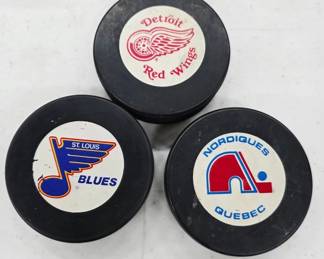 	3 NHL Team Hockey Pucks