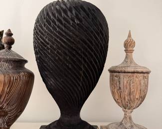 Several carved wooden finials. 