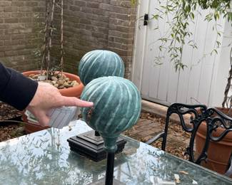 Metal swirl outdoor decor on stands