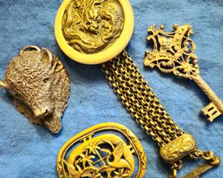 Unique jewelry and Asian purse handle. Buffalo is hand cast pendant. Key is a brooch.