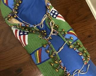 Native American beaded baby carrier with no back boards.