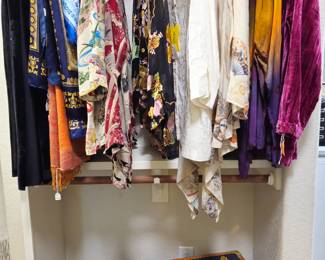 Citron silk tops, beautiful scarves and shawls, great vintage trunk-style suitcase by Ritz Paris.