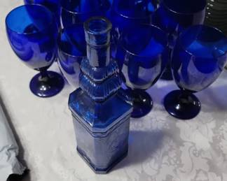 Item 18 Blue Bayou Glass Collection Includes 1 Pitcher, 8 Wine Goblets and 8 Champagne flutes  $32  FREE DECANTER