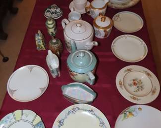 Bone china and porcelain tea cups, plates  and teapots.