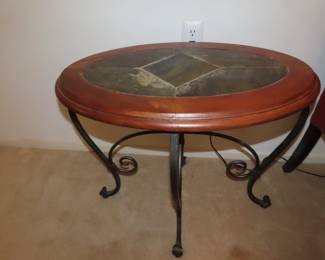 Tile topped oval end table.