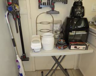 Dyson stick vacuum, airfryer and blender.