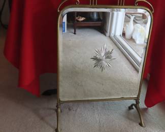 Mirrored fire screen.