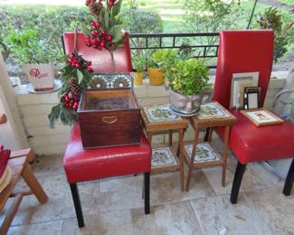 Vintage tile topped plant stands, two leather dining chairs, succulents and cactus.