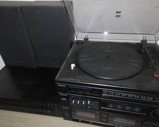 Panasonic stacking stereo with turntable and speakers.