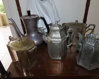 Collection of brass, metal, pewter and iron teapots and kettles.