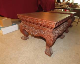Two matching Asian low end tables.