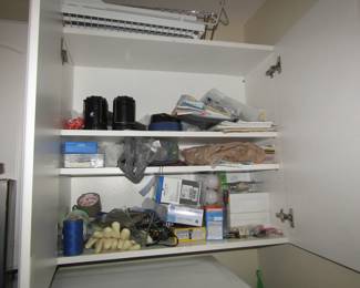 laundry room cupboard with light bulbs & more