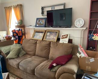 Sofa/couch, vintage bar signs, Red Wing memorabilia, U of M side table, all for sale.