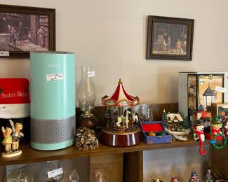 Music boxes, Hummels, wall decor, and home goods featured in the sale.