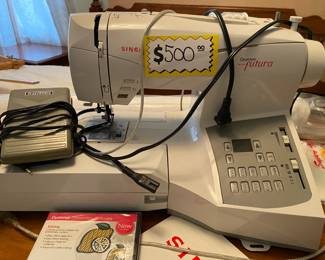 Singer Quantum Futura CE-200 Embroidery Sewing Machine with Software Package in original packing, including plastic wrapped software. Similar machines costs more than $1,000.
