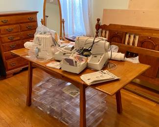 Sewing machines, fabric, wood table with extensions out, plastic storage containers, bedroom set and Cheval Mirror