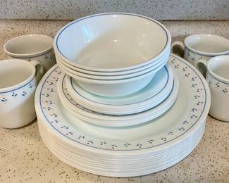 Corelle dishware for 4, with 4 extra dinner-sized plates.
