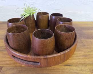 Round wooden tray with eight wooden glasses