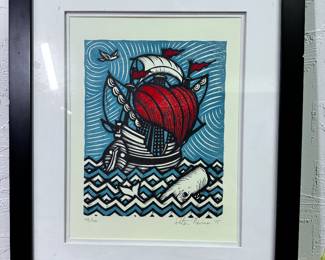 signed block print of ship and whale