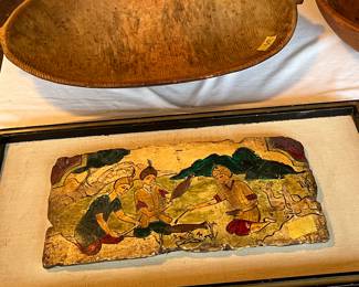 Stone carved art on board