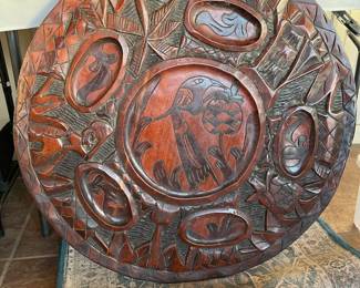 Hand carved double sided table top.