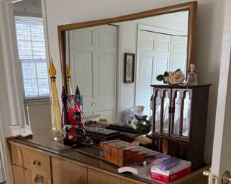 Kent Coffey "The Sharon" mirrored dresser. 64"L; 20"W; 32"H; Drawers 15" depth, End drawers 22" W; Middle drawer 15" W; Mirror measures 48" x 42"