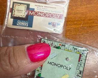 miniature Monopoly board and box 