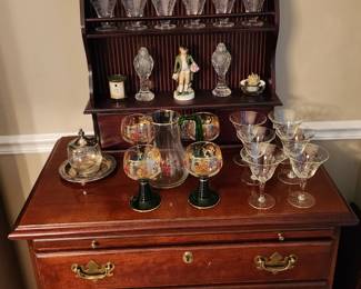Nice 4 drawer server. Beautiful collectible glassware, including AJKA Aravella cut to clear multicolor 4 wineglasses.