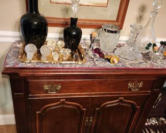 Very nice 2 door, 1 drawer sideboard. Various glass decanters.