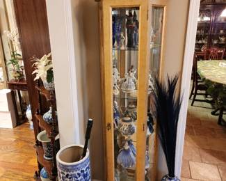 Large blue & white umbrella stand plus curio cabinet. 