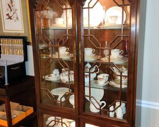 Beautiful lighted china cabinet.